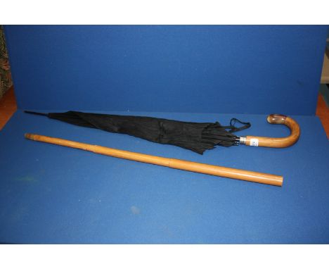 A Gentleman's Umbrella in the form of a walking Stick, the holder being telescopic and handle having a horn tip made by  Kass