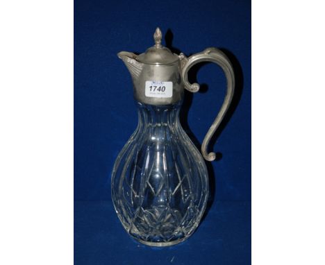 A cut glass Claret Jug with silver plated top and handle.  12'' high