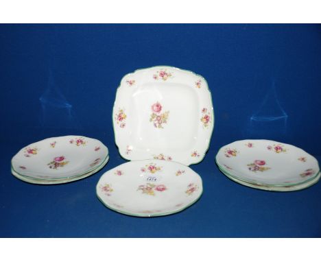 A set of five Royal Worcester Plates, white ground with floral decoration and green rim along with a matching Dish