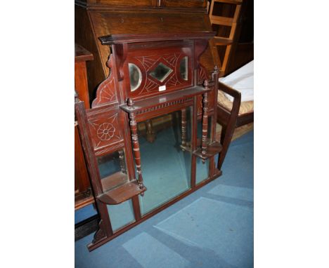 An Edwardian Chestnut overmantle Mirror, having moulded top over carved panel with two 'D'  shaped mirrors separated by diamo