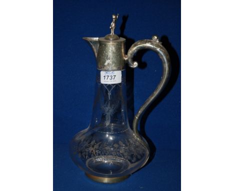 A clear glass Decanter with plated handle and cherub finial.
