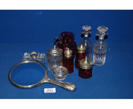 A Cranberry glass cruet with plated tops, cranberry glass cream jug a/f, clear glass silver rimmed cruets, hand mirror and si