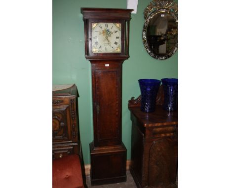 A Georgian country Oak cased longcase Clock having moulded cornice to the hood with two turned supports flanking the central 