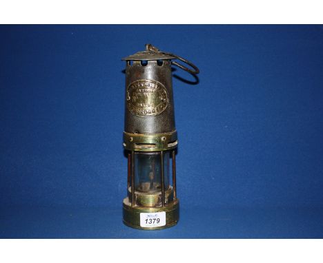 A Brass and iron Miner's Lamp by Thomas Williams of Aberdare.  10 1/2'' tall