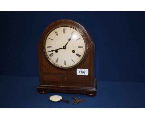 A chiming Mantle Clock with key and pendulum