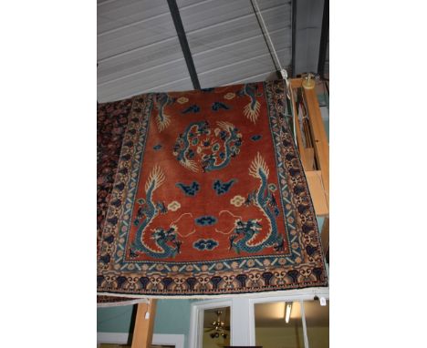 A vintage Chinese hand knotted Carpet, with six dragons on peach field, 8' 4'' x 5'2'' (250 cms x 155 cms)