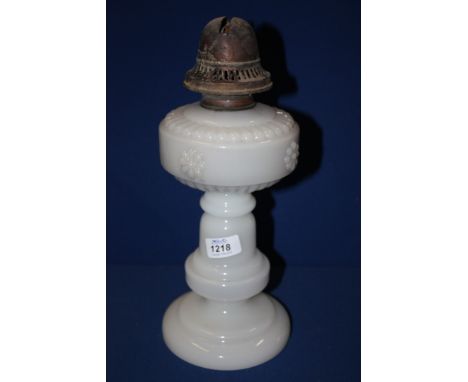 A white glass Oil lamp Base with moulded floral and scalloped design.  12 1/2'' tall.  No chimney or shade