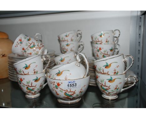 A Royal Grafton Teaset with exotic bird pattern comprising twelve cups and saucers, twelve tea plates, two cake plates, sugar