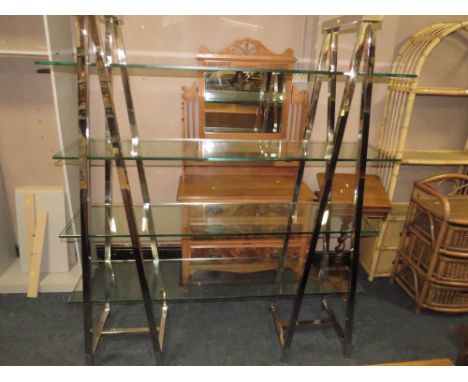 A MODERN GLASS AND CHROME FOUR SHELF OPEN BOOKCASE