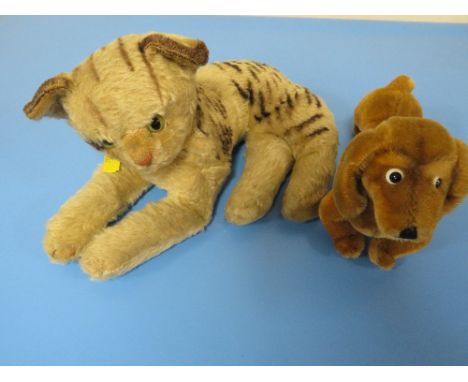 A STEIFF DACHSHUND TOGETHER WITH A  STEIFF BABY TIGER (NO LABELS BUT BUTTONS IN EARS )