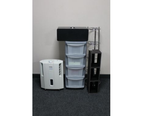 A Delonghi slim de-humidifier, leather CD rack, metal pan stand, plastic four drawer chest and a Ipod dock speaker 