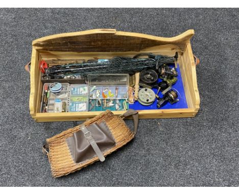 A pine twin handled fishing box containing creel, landing nets, vintage and later reels, lures etc 