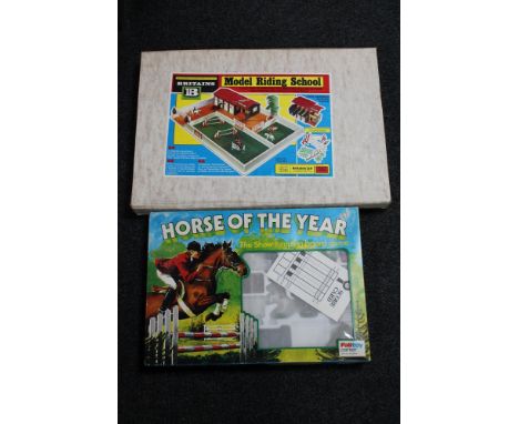 A Palitoy Horse of the Year showing jumping board game and a vintage Britons model riding school in original box 