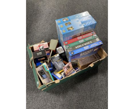 A box of DVD box sets, jigsaws, vintage electrical items, card sets etc 