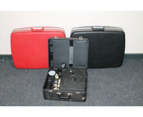 A cased Kodak Carousel projector and two luggage cases 