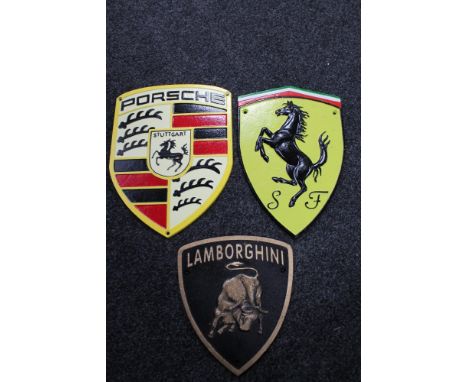 Three cast iron plaques - Porsche, Ferrari, Lamborghini 