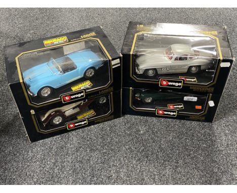 Four boxed Burago 1/18 scale die cast vehicles : Jaguar E Cabriolet, Lancier Spider, Mercedes Benz SK and a Mercedes Benz 300