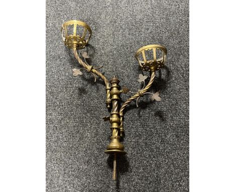 An antique brass two branch candle holder  CONDITION REPORT: Height 60cm. width 45cm. Minor loss to middle finial, otherwise 