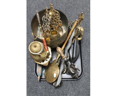 A tray of assorted brass ware, horse brasses on strap, vintage mincer, flat iron etc 
