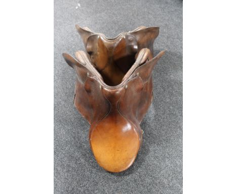 Two vintage tan leather saddles 