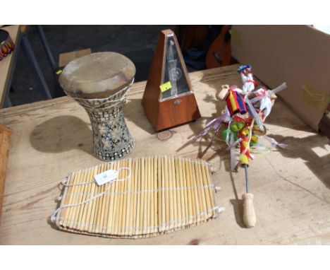 Small drum, rattle, percussion instrument and metronome  