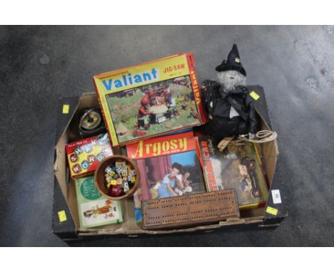 Box of vintage games, jigsaws, cribbage board, witch puppet etc