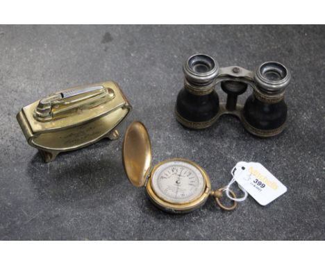 Pair of opera glasses, pocket barometer and desk lighter 