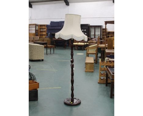 A modern standard lamp with shade 