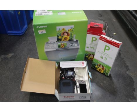 A Cannon IXUS 60 digital camera and compact photo printing system 
