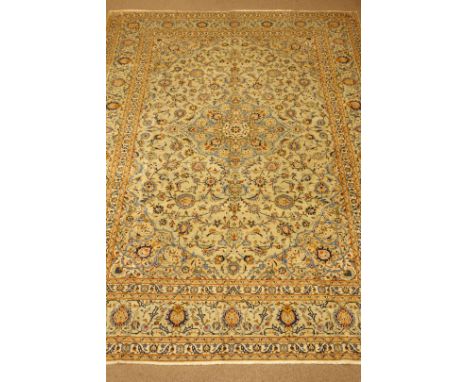Kashan light green ground, central medallion, floral and foliate field, repeating border, 422cm x 311cm 