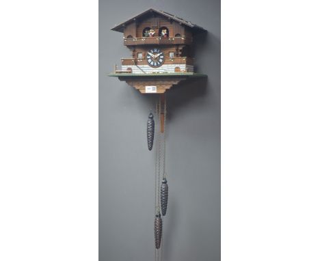 Swiss chalet style cuckoo clock, triple weight driven musical movement, W31cm