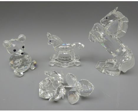 Four pieces of Swarovski crystal; Rearing Horse, H11cm, Rocking Horse, Rose and Teddy Bear (4)