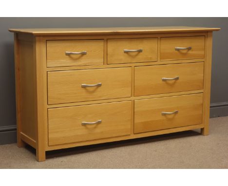 Light oak chest, three short and four long drawers, stile supports, W138cm, H78cm, D43cm