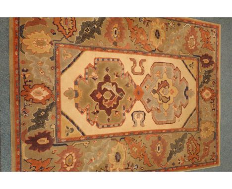 Turkish style rug, beige ground, (194cm x 144cm) and a chinese style rug, light green ground, (186cm x 122cm)