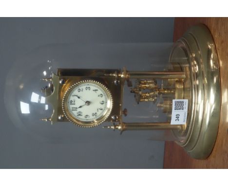 Late 19th century brass anniversary clock, under glass dome, H31cm