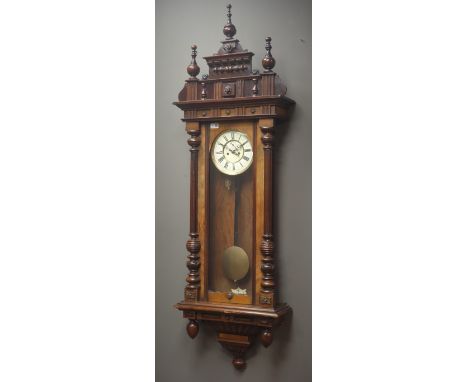 Large Vienna walnut cased wall clock, triple finial pediment, circular Roman dial, twin train movement striking on coil, H163