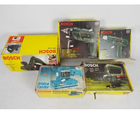 A collection of boxed Bosch power tools to include planer, hammer drill, hot air gun and other.