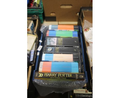 A TRAY OF SEVEN FIRST EDITION J. K. ROWLING HARRY POTTER BOOKSConditionReport:Faded spines