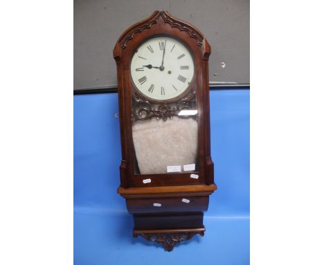 AN ANTIQUE MAHOGANY WALL CLOCK WITH WINDER
