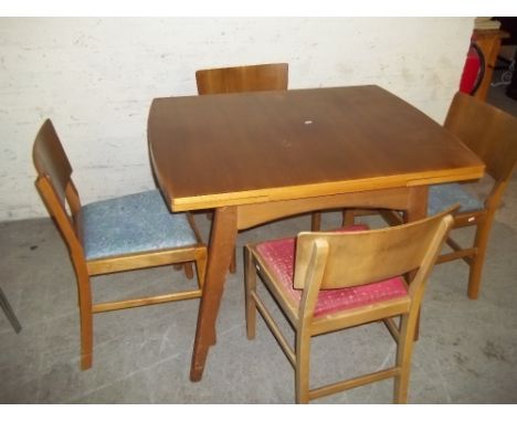 A TEAK EXTENDING DINING TABLE WITH FOUR CHAIRSChairs have a fair bit of cosmetic wear and tear, obviously a well used item. T