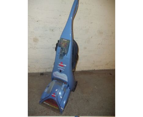 A BISSELL POWERBRUSH CARPET CLEANER