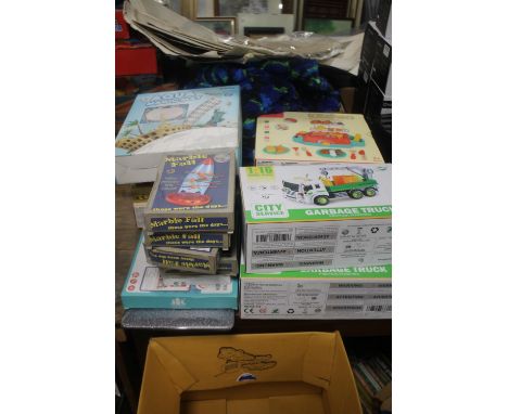 A LARGE QUANTITY OF CHILDREN'S GAMES TO INCLUDE TWO FRICTION DRIVEN GARBAGE TRUCKS, TW KITCHEN BARBECUE PLAY SETS, A HAPPY MO
