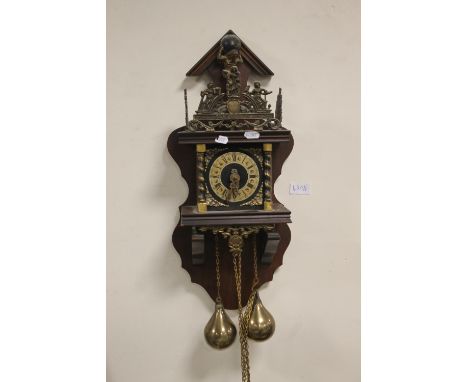 A REPRODUCTION WALL CLOCK WITH BRASS WEIGHTS