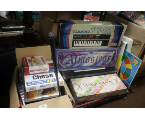 A BOX OF DVDS TO INCLUDE ROBOTCOP, FAMILY AT WAR ETC TOGETHER WITH A QUANTITY OF BOXED GAMES, ATMOSPHERE, SOLITAIRE ETC, AND 