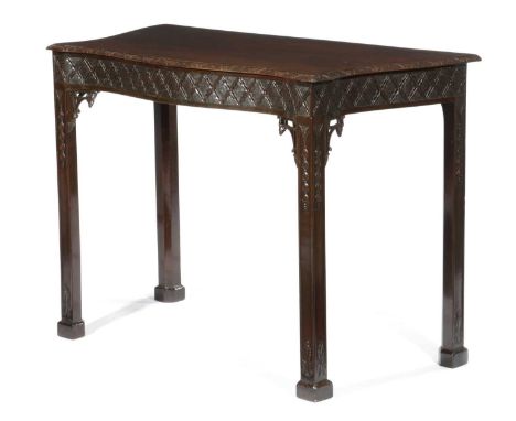 A MAHOGANY SERPENTINE SIDE TABLE IN CHINESE CHIPPENDALE STYLE, LATE 19TH CENTURYcarved with ribbons, leaves and husks77.7cm h
