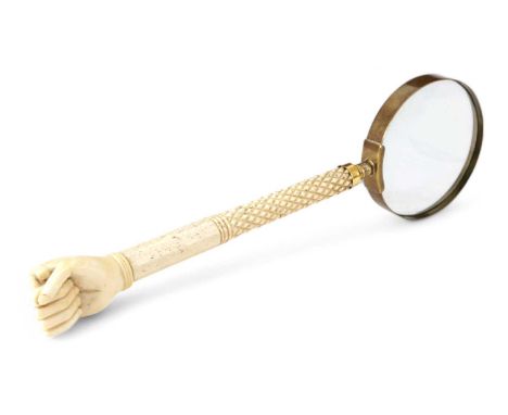 λ A SAILOR'S WHALEBONE AND MARINE IVORY MAGNIFYING GLASS19TH CENTURYthe finial carved as a clenched first, on an octagonal sh