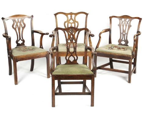 FOUR GEORGE III MAHOGANY ARMCHAIRSLATE 18TH CENTURYeach with a pierced vase shaped splat, one finely carved with leaves in th