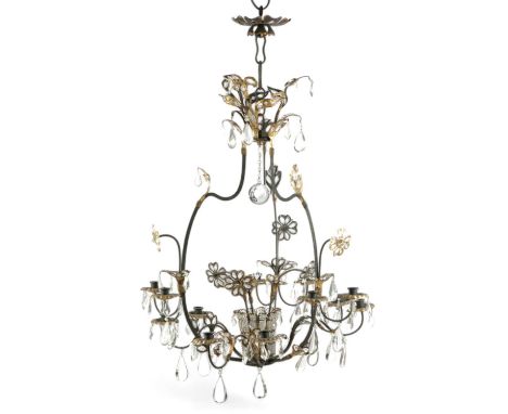 A FRENCH GILT AND EBONISED METAL TWELVE LIGHT CHANDELIERIN THE MANNER OF MAISON JANSEN, C.1940of open form, with scrolling le