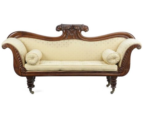 λ A WILLIAM IV ROSEWOOD SOFAC.1830with a leaf and leopard head cresting above scroll ends, upholstered with yellow silk with 