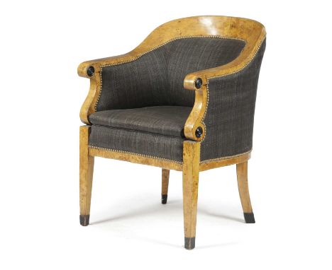 A BIEDERMEIER KARELIAN BIRCH BERGÈRE POSSIBLY RUSSIAN OR SWEDISH, FIRST HALF 19TH CENTURYwith ebonised rondels and block feet
